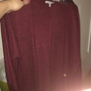 a maroon cardigan